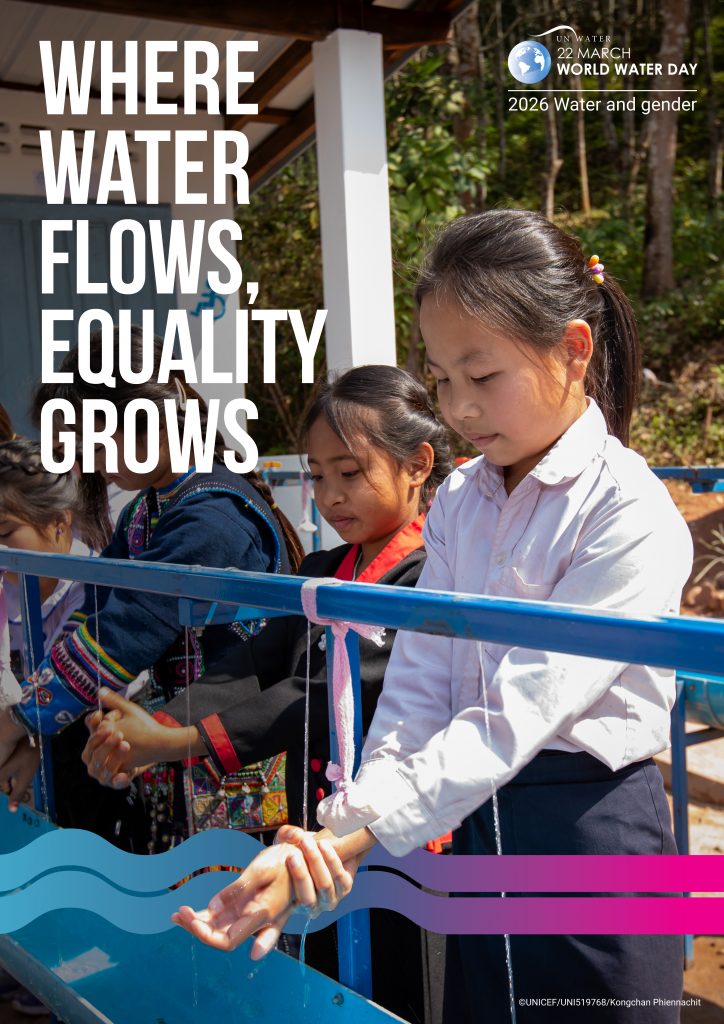 Photo of girls washing hands at a water station.